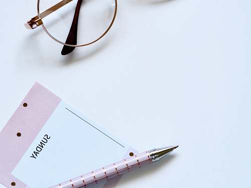 coffs harbour eyeglasses near paper and ballpoint pen australia